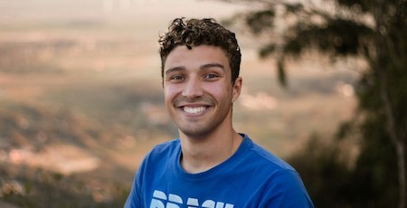 Young adult smiling and standing independent.